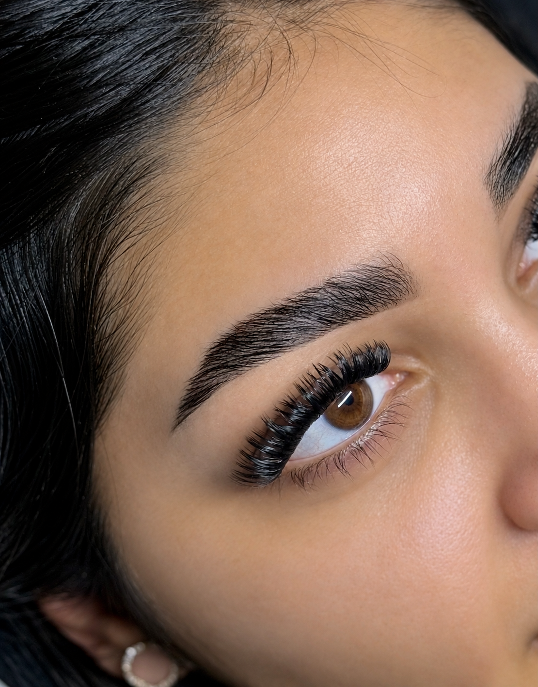 Close-up of beautifully shaped brows and lifted lashes